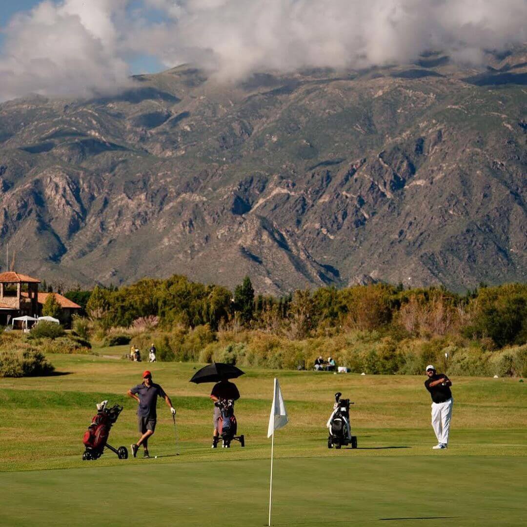 Panoramic view of an Argentine golf course with mountains in the background